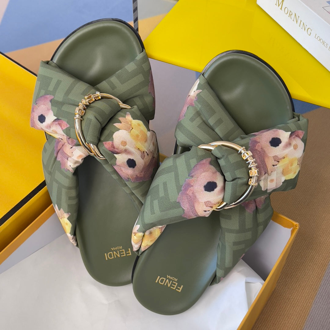 Olive Fendi slide sandals with FF pattern straps, floral bows, gold ring hardware