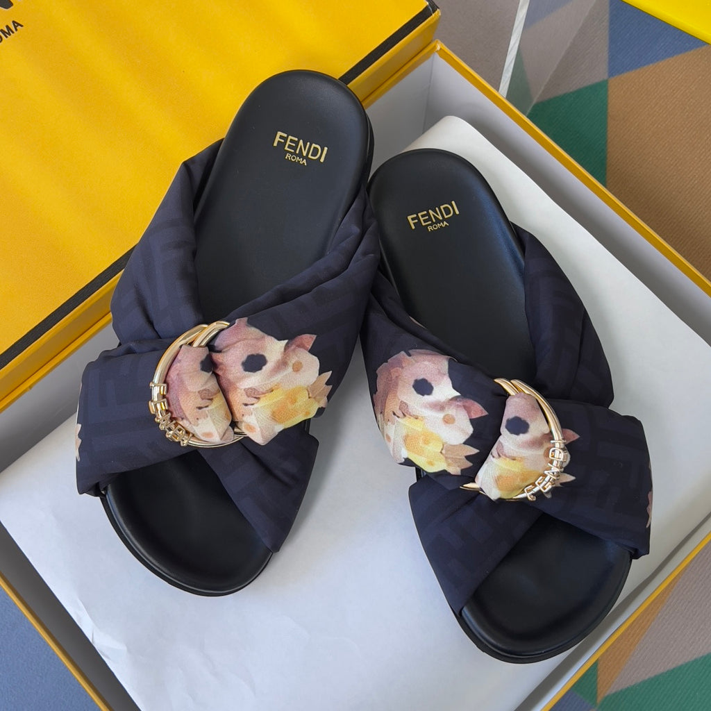 Dark navy Fendi sandals with floral bow straps and gold ring buckle detail