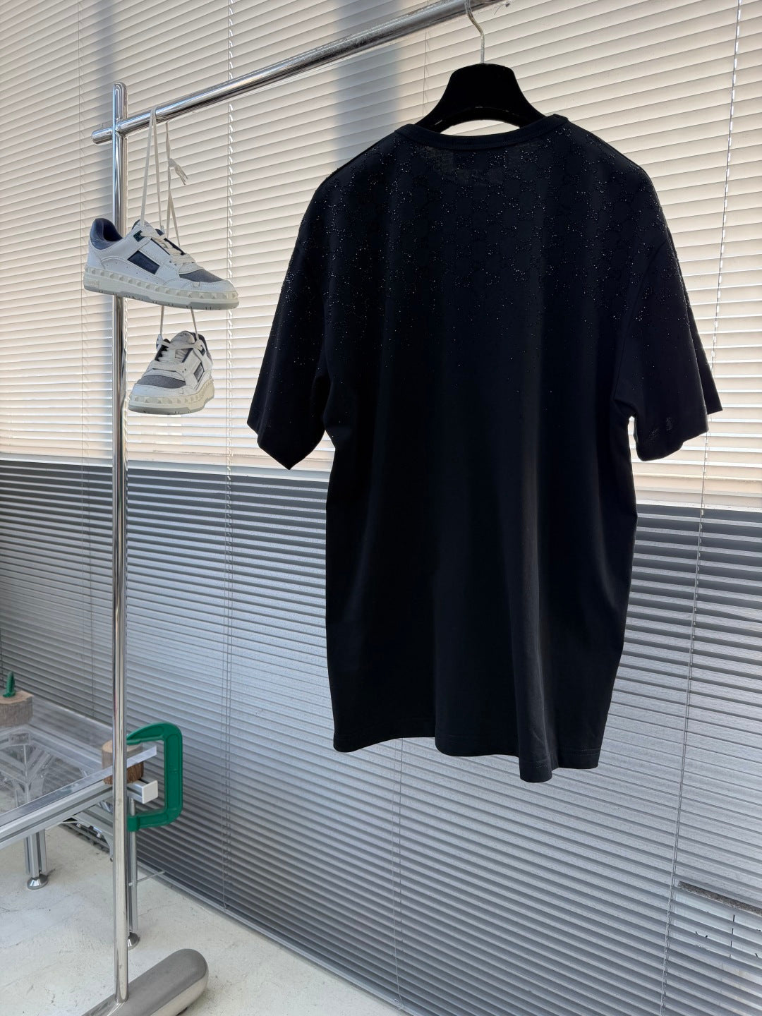 Black Gucci short-sleeve T-shirt back view hanging