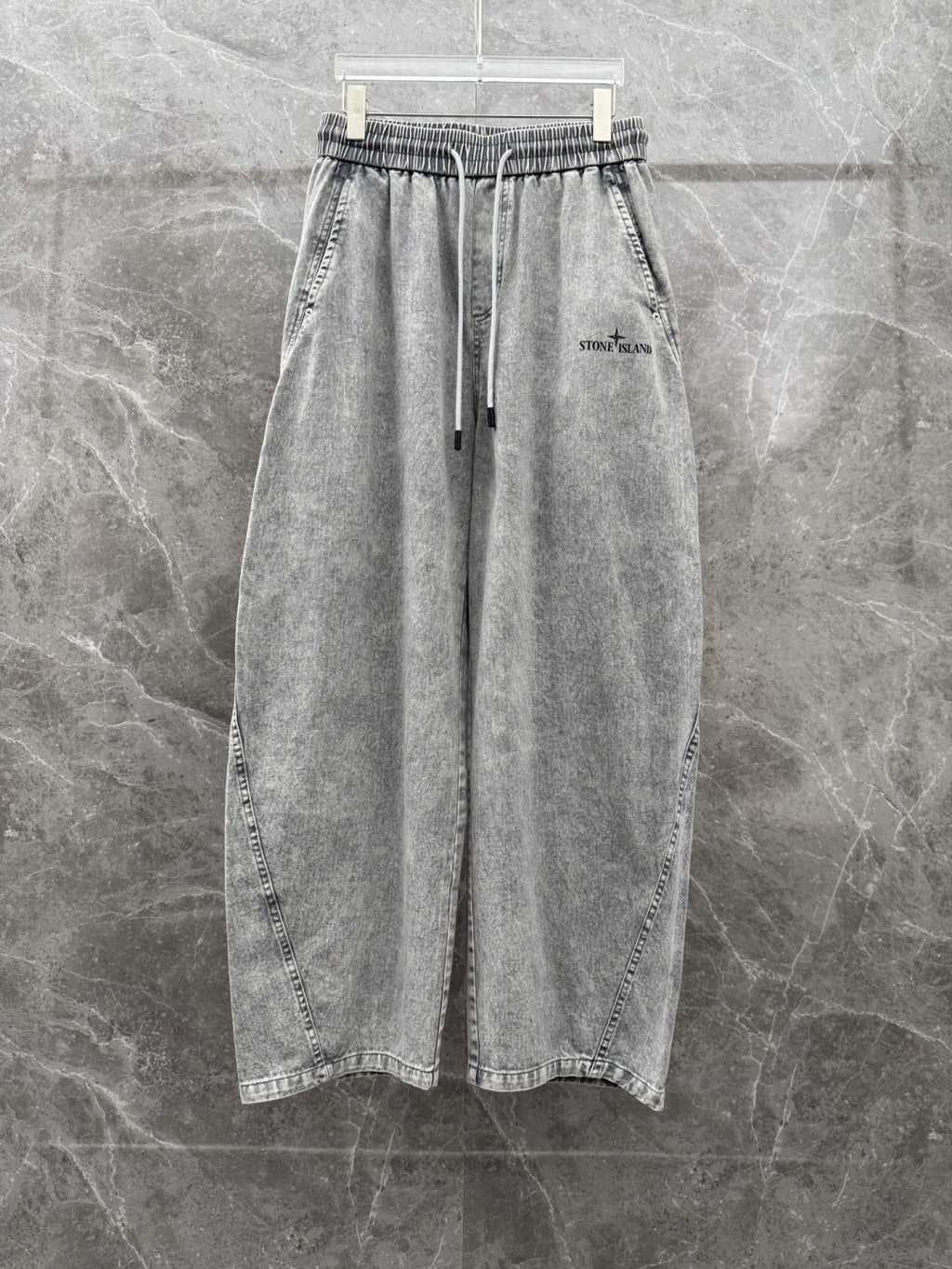 Grey denim jogger pants, front view, elastic waistband with drawstring