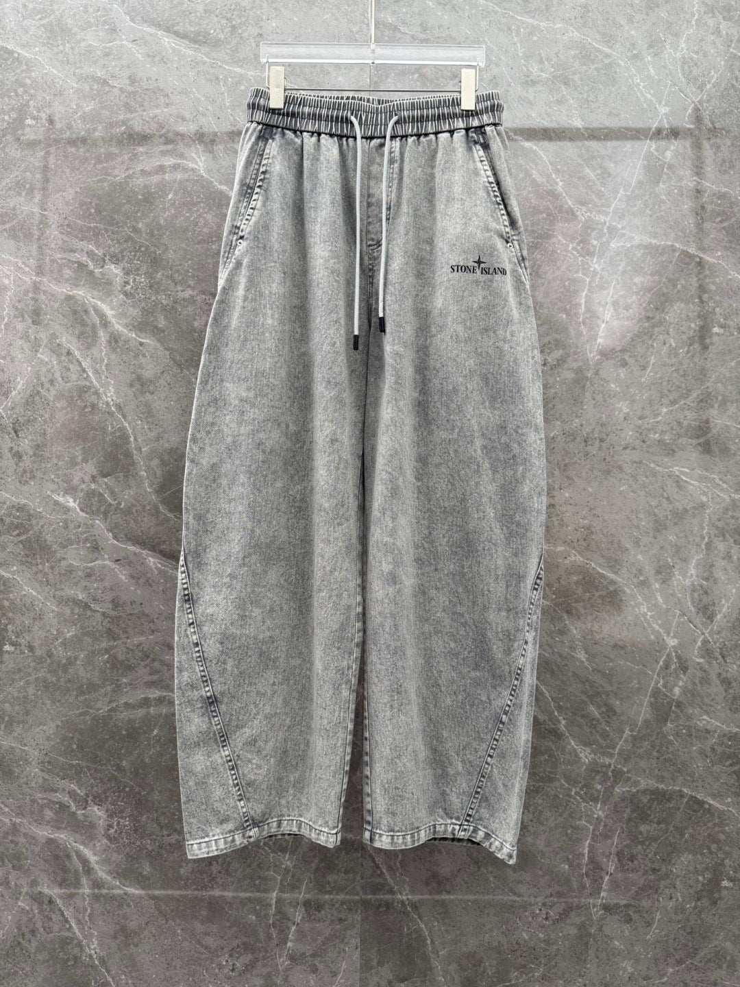 Grey denim jogger pants, front view, elastic waistband with drawstring