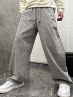 Grey stone-wash denim jogger pants with drawstring and side seam pockets