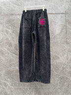 Wide-leg denim pants, dark wash, elastic waistband with drawstring; pink back logo patch.