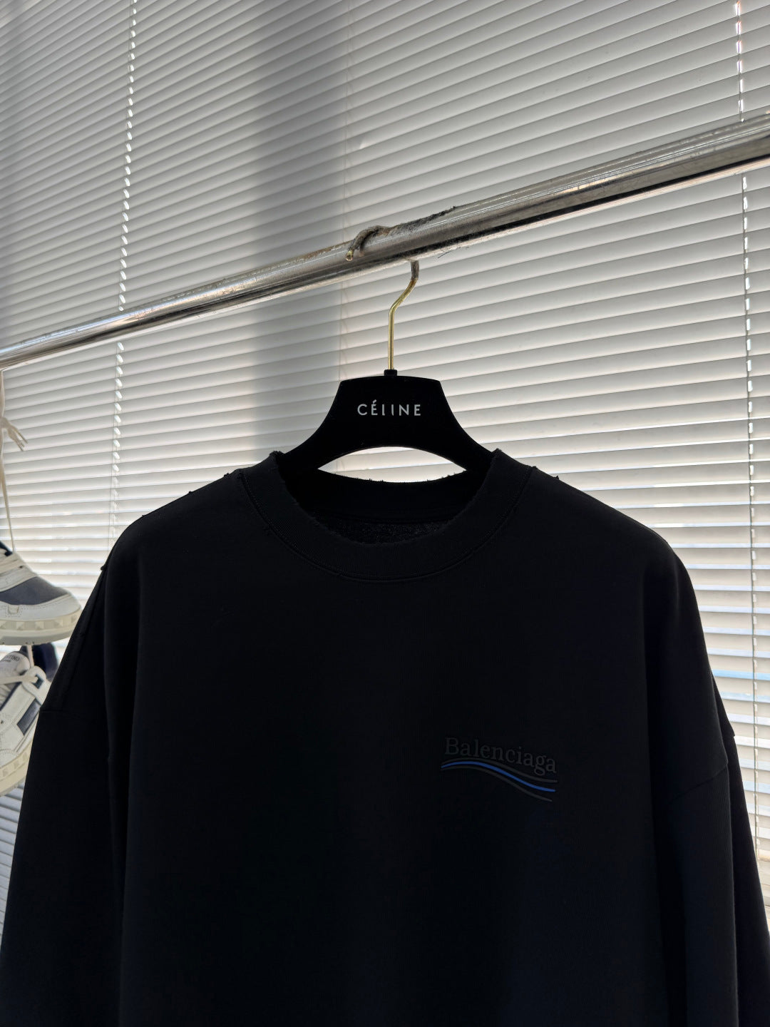 Balenciaga black crewneck long-sleeve sweatshirt front chest logo