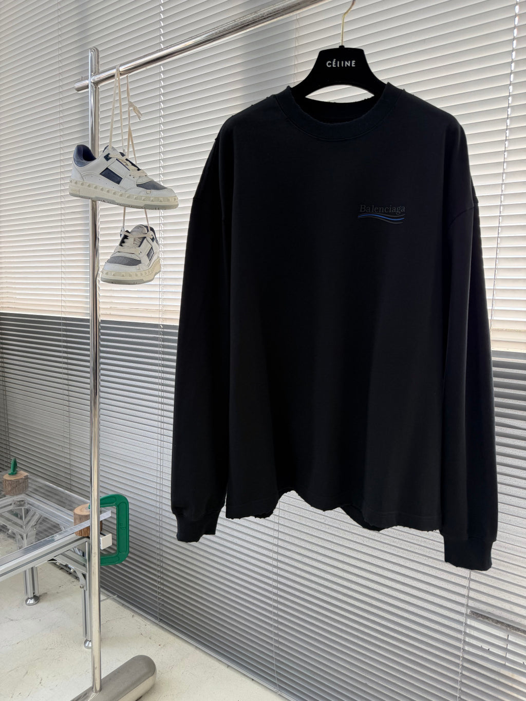 Balenciaga black crewneck long-sleeve sweatshirt on hanger