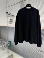 Balenciaga black crewneck long-sleeve sweatshirt on hanger