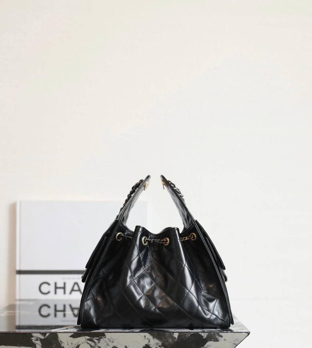 Chanel quilted leather hobo bag in dark tone with dual chain handles