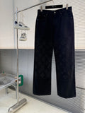 Dark denim pants with tonal monogram pattern, belt loops, and front pockets