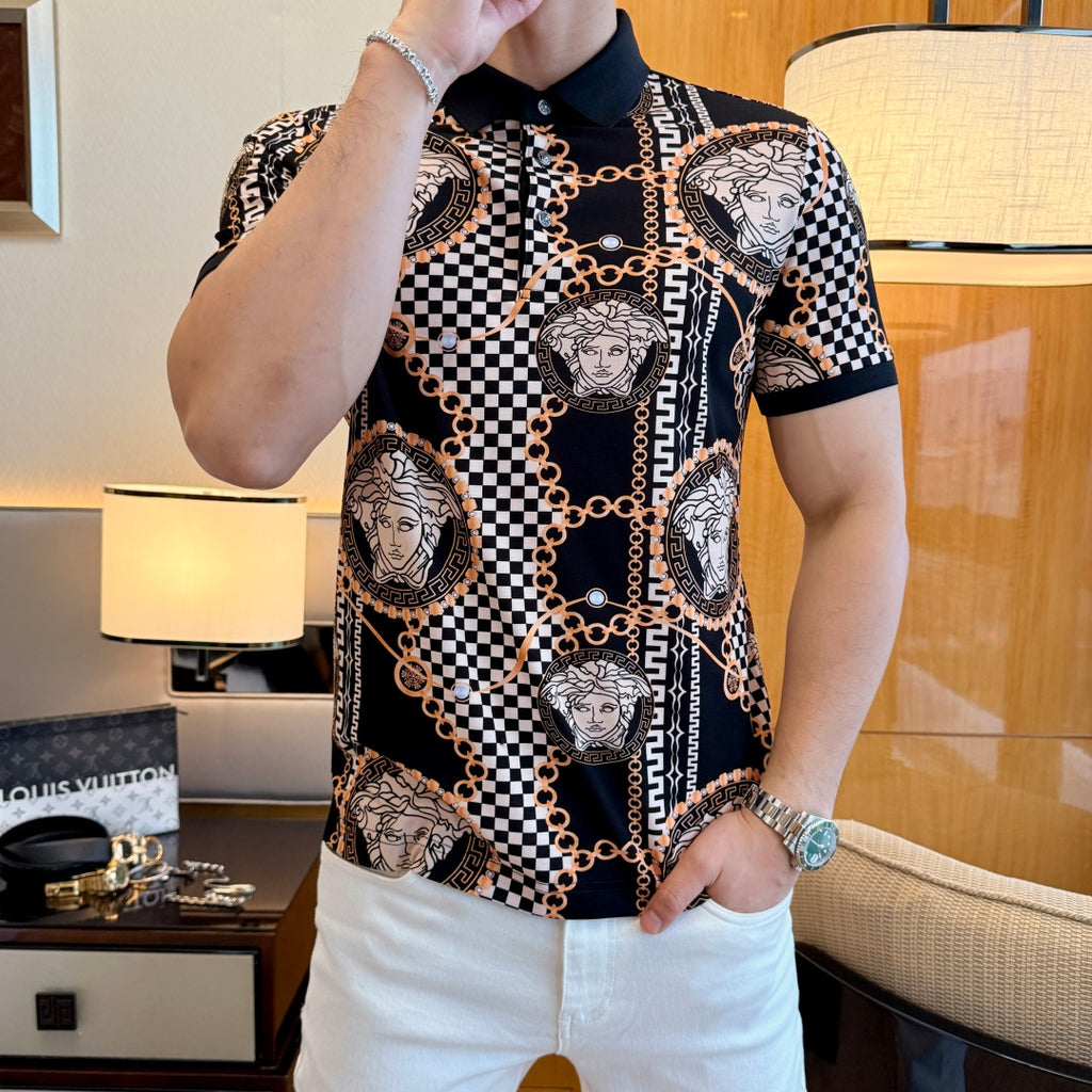 Black polo shirt with pointed collar, button placket, Medusa portrait print, and gold chain links.