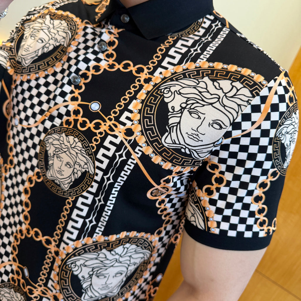 Black polo shirt with large Medusa medallion, checkered stripe, and gold chain trim on chest.