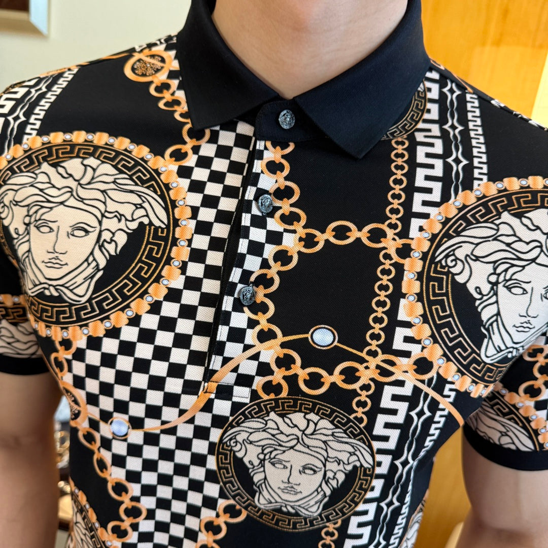 Black polo shirt chest close-up with gold chain links, checkered stripe, and Medusa medallions.