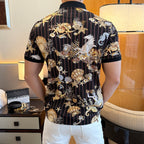 Back view of short-sleeve polo shirt with dark vertical stripes and seashell graphic