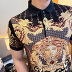 Polo shirt close-up: gold-red baroque face motif and chain patterns on black knit