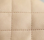 Chanel beige quilted leather panel with diamond stitching detail.