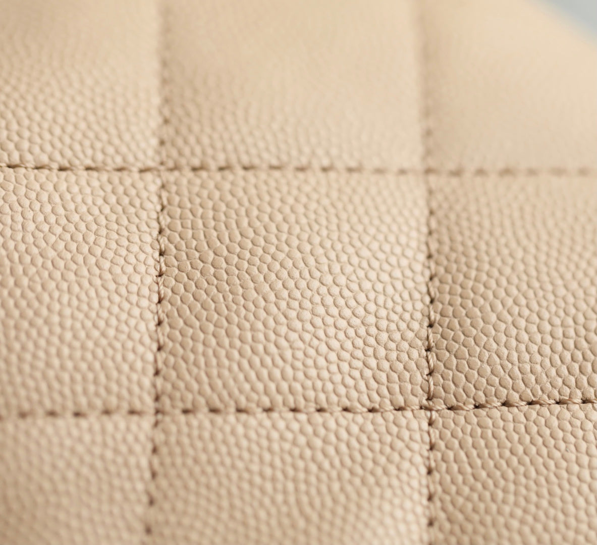 Chanel beige quilted leather panel with diamond stitching detail.
