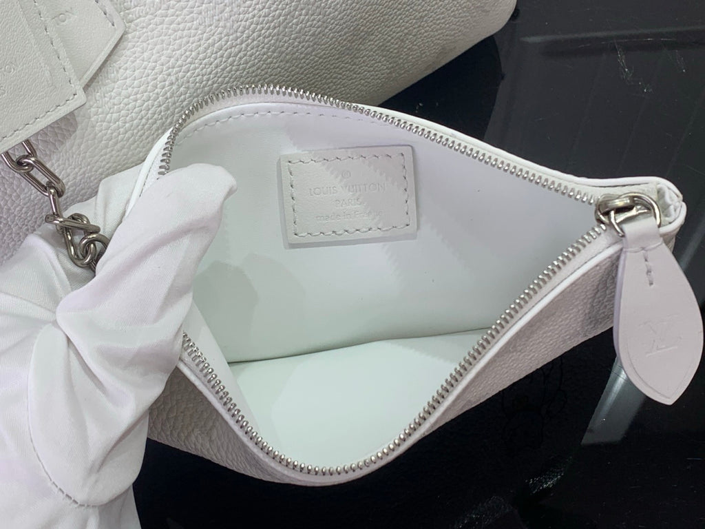 Louis Vuitton white leather bag with top zipper and interior label