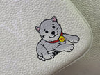 Light leather bag with embroidered cartoon dog and small logo patch
