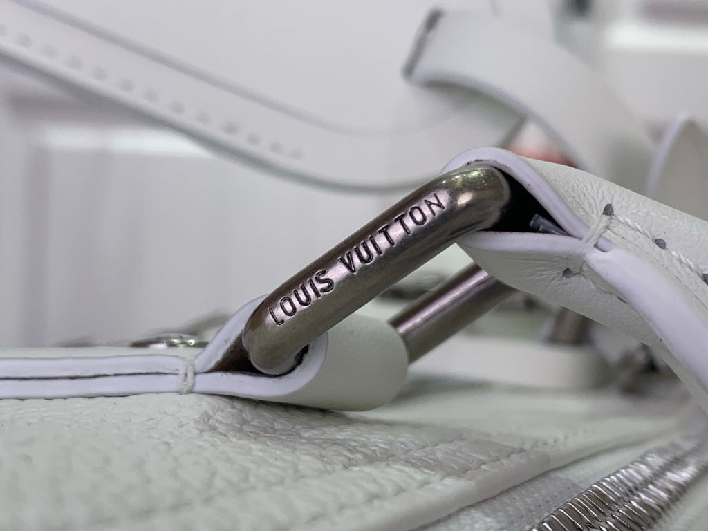 White leather handbag with branded leather zipper pull tab
