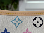 Close-up of multicolor monogram icons on white textured leather