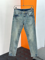 Light-wash denim jeans with button closure, belt loops, and two front pockets