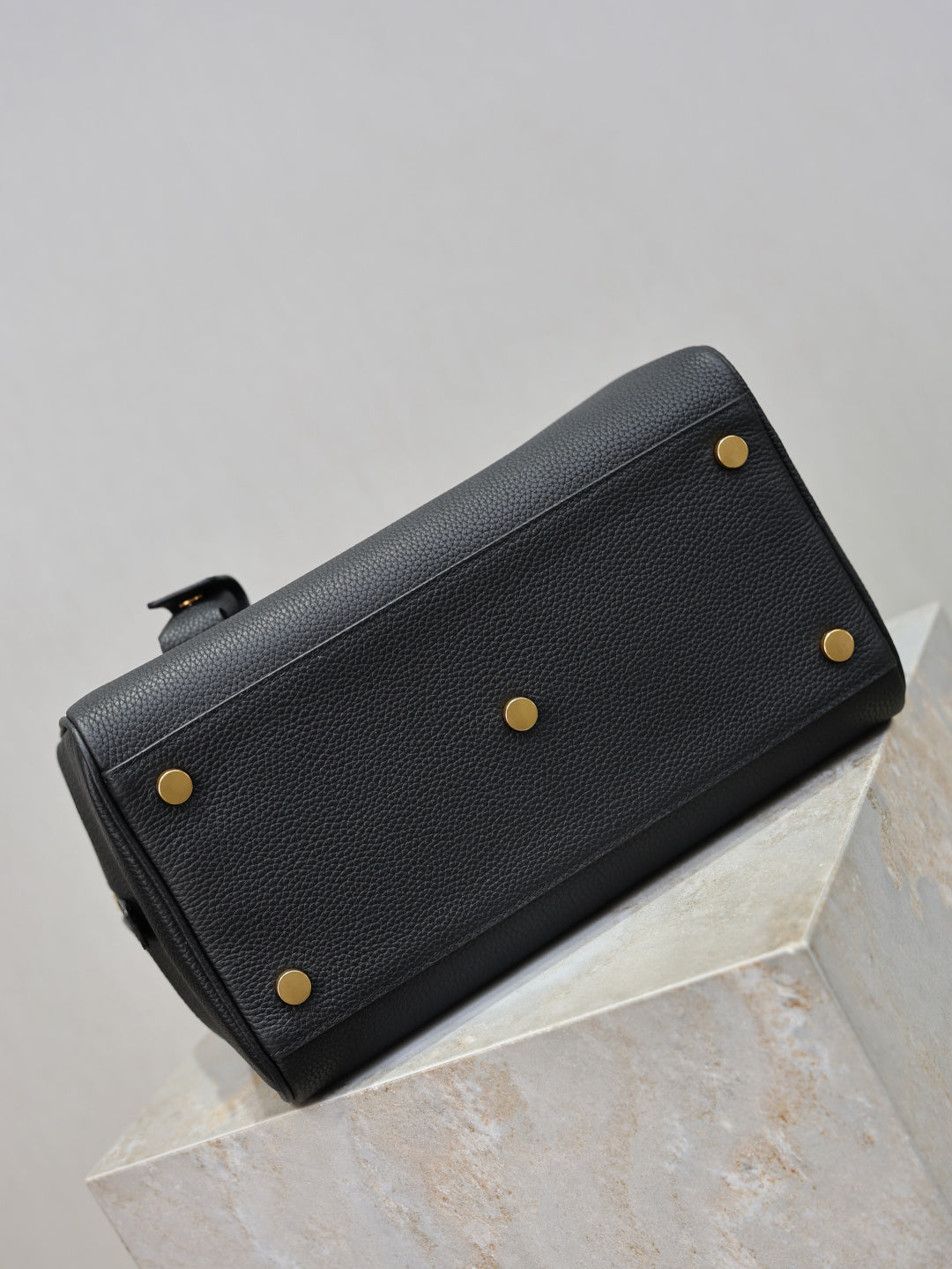 Black pebbled leather zip wallet with gold-tone studs and side hardware