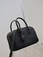 Black structured handbag with double top handles and crossbody strap