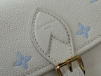 White Louis Vuitton bag panel with blue flower pattern and gold-tone buckle clasp