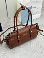 Brown Prada small shoulder bag with top handle, crossbody strap, and logo emblem