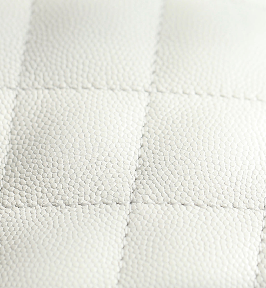 Chanel handbag quilted white leather with diamond texture, close-up