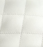 Chanel handbag quilted white leather with diamond texture, close-up