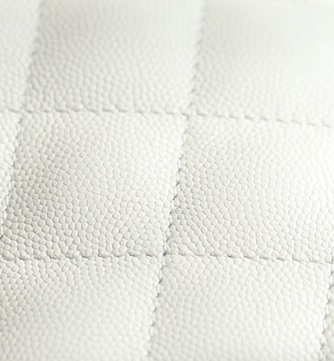 Chanel handbag quilted white leather with diamond texture, close-up