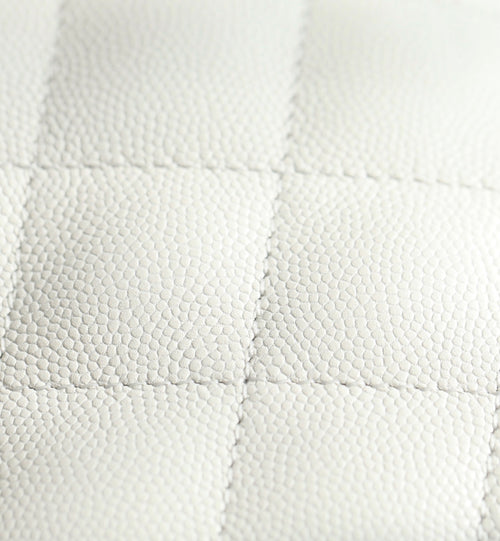 Chanel handbag quilted white leather with diamond texture, close-up