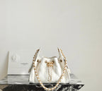 Chanel white quilted handbag with gold chain and top handles, front clasp detail