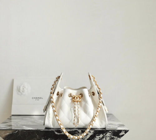 Chanel white quilted handbag with gold chain and top handles, front clasp detail