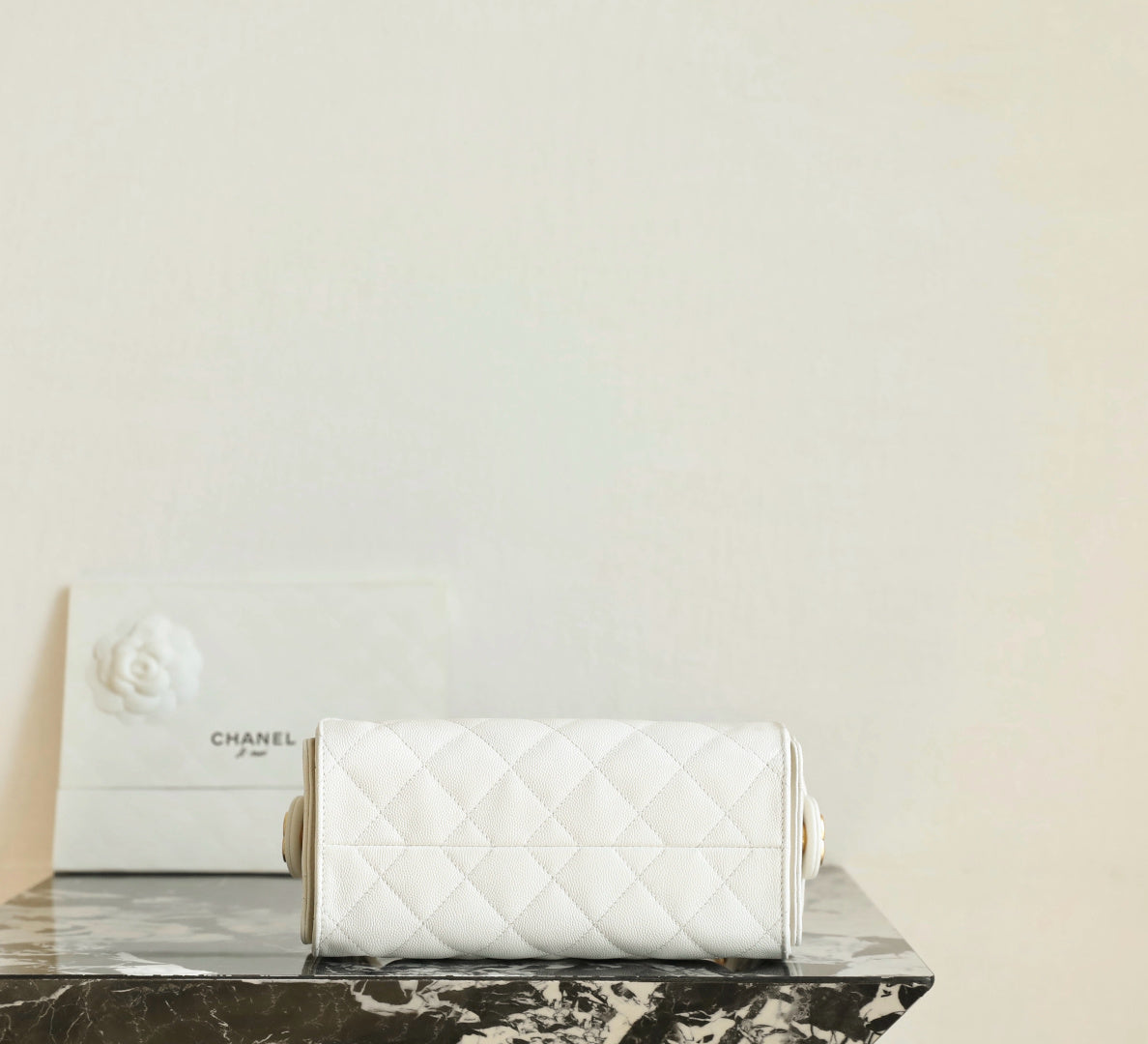 Chanel white quilted clutch-style handbag with chain strap, front view