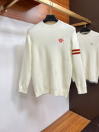 Off-white Versace crewneck sweater with small red logo on chest.