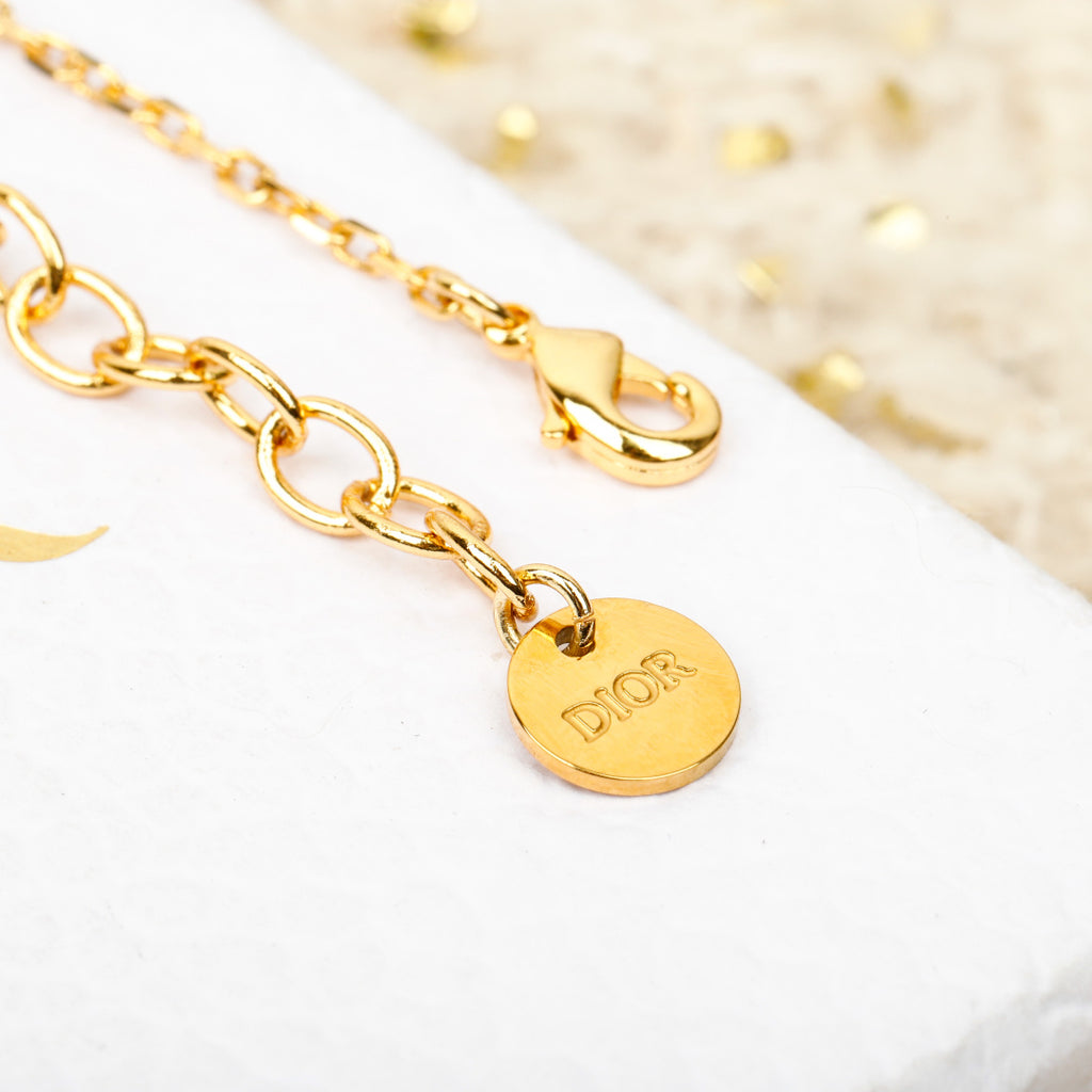 Gold-tone chain bracelet with round 'Dior' medallion charm