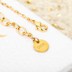 Gold-tone chain bracelet with round 'Dior' medallion charm