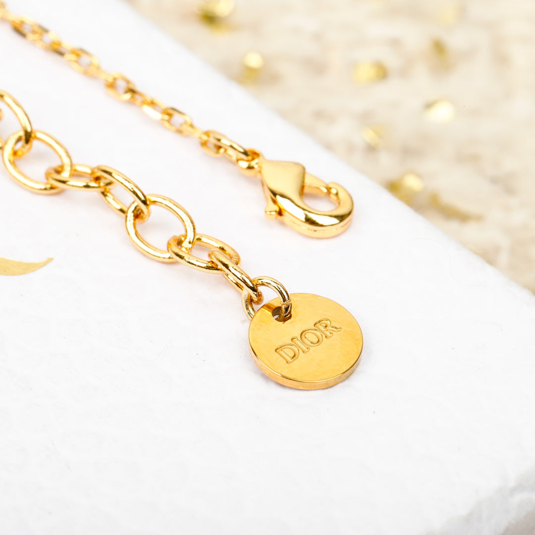 Gold-tone chain bracelet with round 'Dior' medallion charm