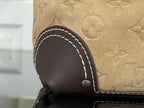 Louis Vuitton monogram bag corner with dark leather trim and white contrast stitching