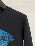Versace black sweatshirt sleeve with blue repeating VERSACE text graphic detail