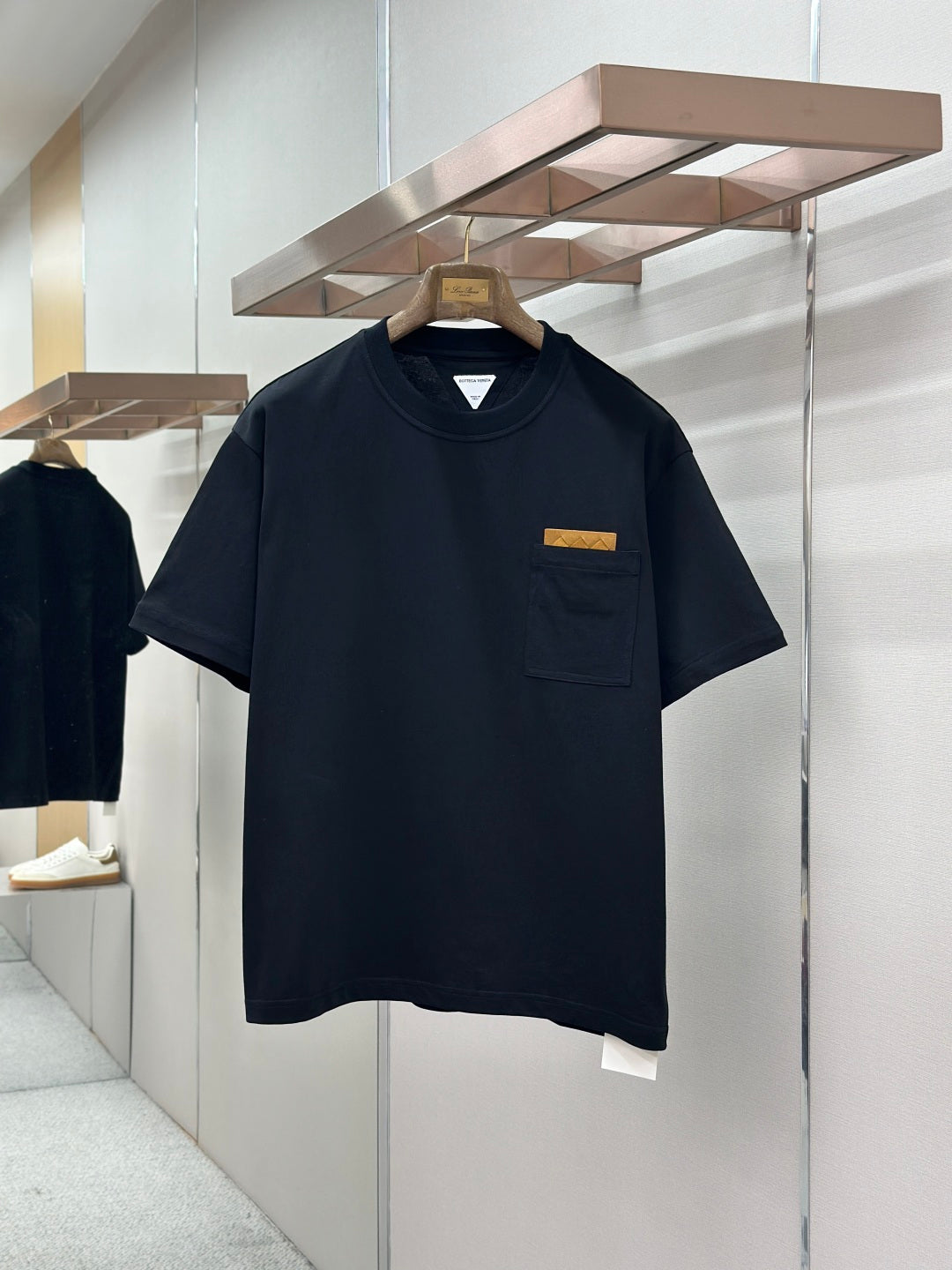 Navy crewneck pocket T-shirt with short sleeves and small front chest logo label