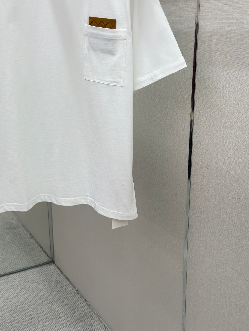 Off-white T-shirt hem and chest pocket detail