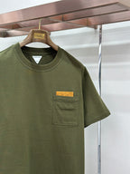 Olive green crew-neck T-shirt with chest pocket and rectangular logo patch