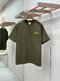 Olive green crew-neck T-shirt with chest pocket and rectangular logo patch