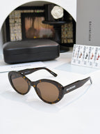 Tortoise round sunglasses with brown tinted lenses and full-rim frame.
