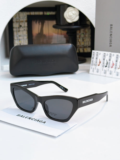Balenciaga cat-eye sunglasses with black frames and dark tinted lenses