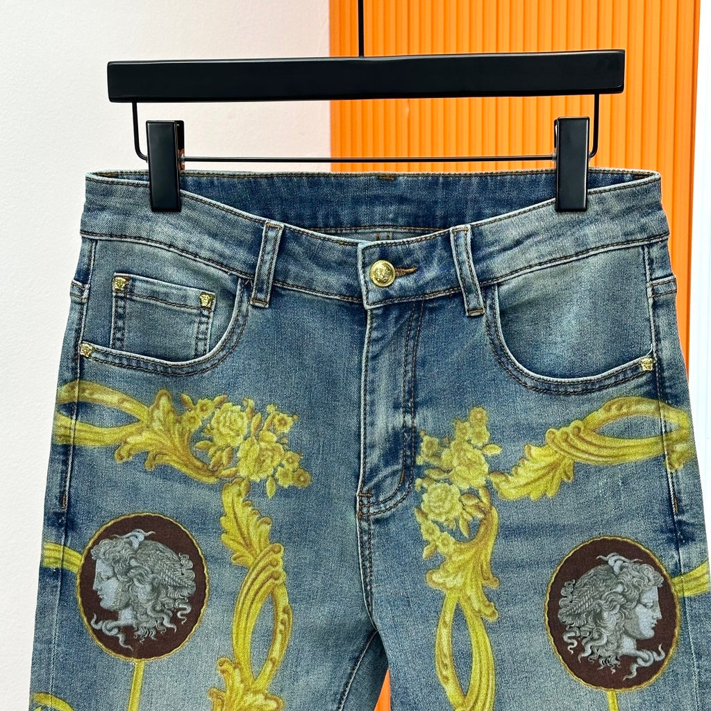 Versace blue denim jeans with gold baroque front panels and logo button