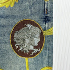 Versace blue denim jeans close-up of oval medallion face print