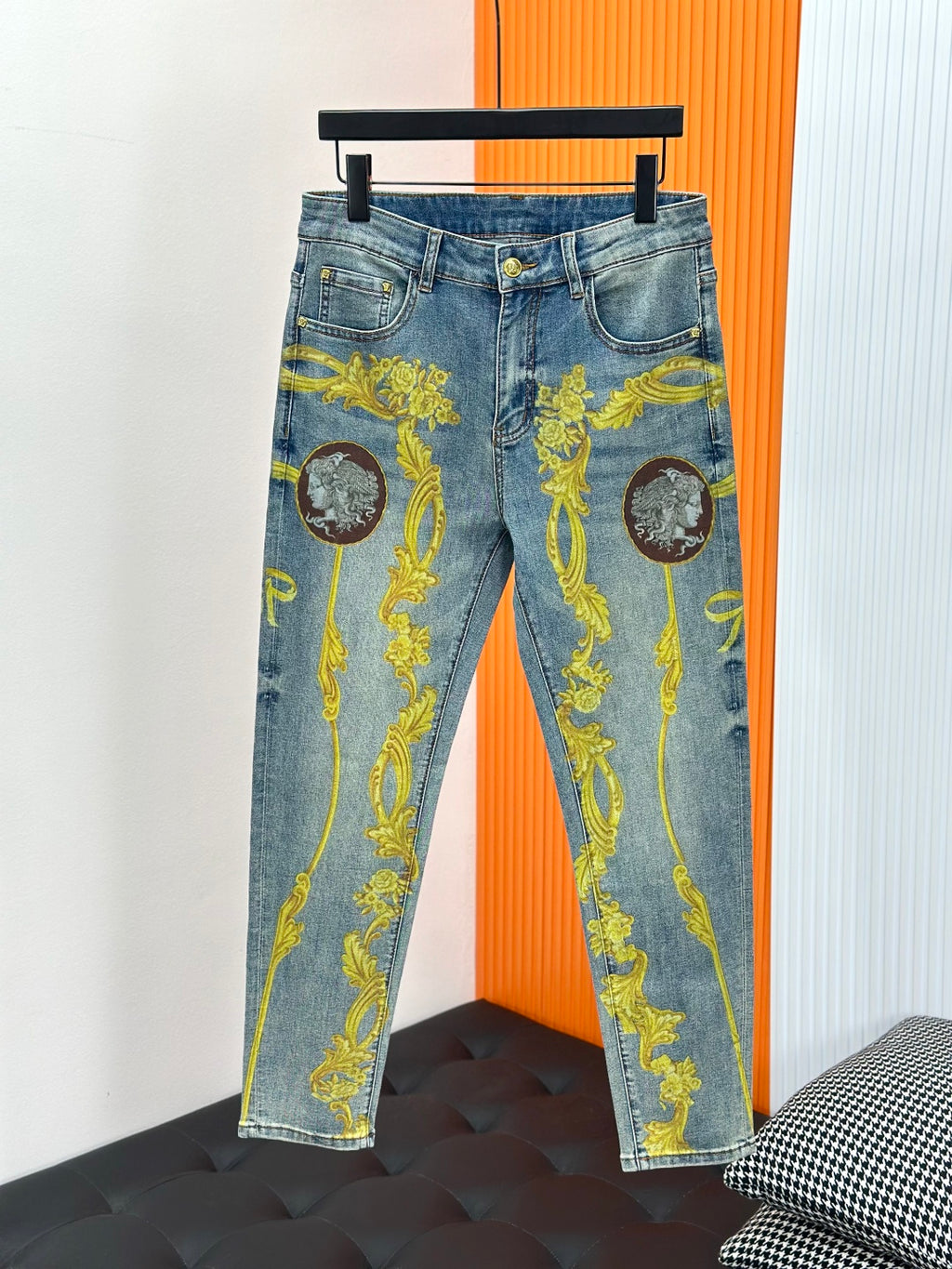 Light blue Versace jeans with gold baroque ornament and medallion prints, full view
